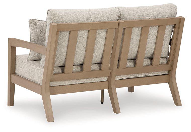 Hallow Creek Outdoor Loveseat with Cushion - Atchison Furniture Company (Atchison, KS)