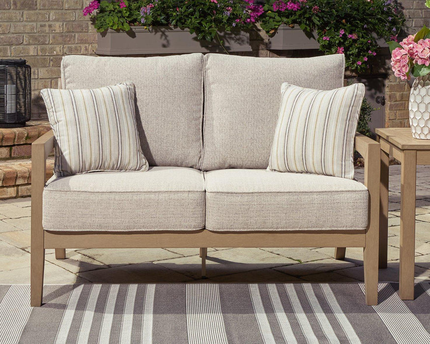 Hallow Creek Outdoor Loveseat with Cushion - Atchison Furniture Company (Atchison, KS)